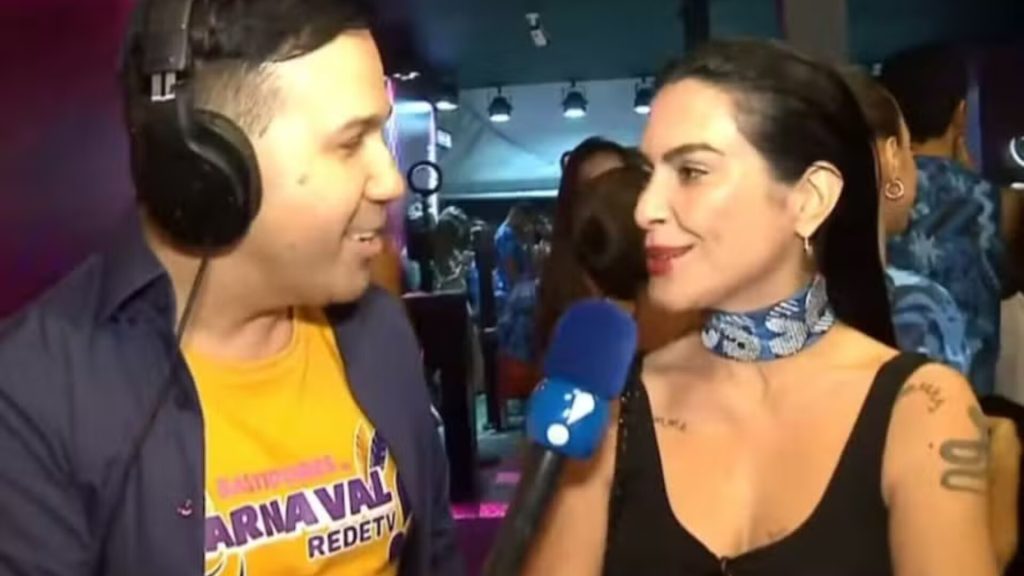 Repórter Viny Vieira, da RedeTV!, e Cleo